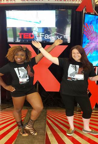 A group of people posing for the camera

Description automatically generated