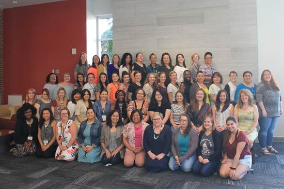 A group of people posing for a photo

Description automatically generated